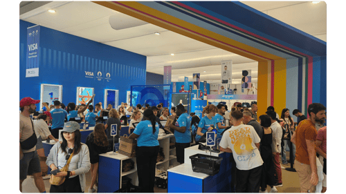 Fans browsing merchandise at a busy sports club retail stand on matchday