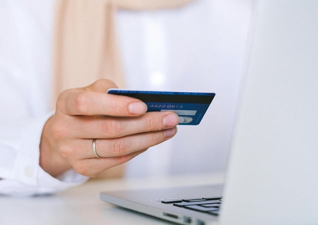 person processing payment of a credit card
